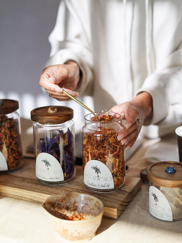 Tea blends being scooped at the Do Not Disturb tea bar.